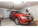 Spacious garage with a car, storage, and well-organized equipment, ideal for vehicles and hobbies at 85 W Grey Stone St, San Tan Valley, AZ 85143