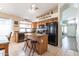 Bright kitchen featuring an island, breakfast bar, granite countertops and stainless steel appliances at 85 W Grey Stone St, San Tan Valley, AZ 85143