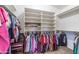 Organized walk-in closet featuring built-in shelving and ample hanging space for clothes at 85 W Grey Stone St, San Tan Valley, AZ 85143
