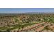 Picturesque aerial view of a lush golf course community with beautiful homes, trees, and scenic views at 9130 W Rimrock Dr, Peoria, AZ 85382