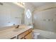 The bathroom boasts a shower over tub and a marble countertop with white walls at 9130 W Rimrock Dr, Peoria, AZ 85382
