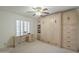 This bedroom boasts built-ins and a writing desk with plantation shutters at 9130 W Rimrock Dr, Peoria, AZ 85382