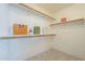 A walk-in closet with built-in shelving and luxury decor at 9130 W Rimrock Dr, Peoria, AZ 85382
