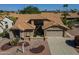 Stunning home features a tile roof, desert landscaping, and a convenient two-car garage at 9130 W Rimrock Dr, Peoria, AZ 85382