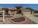 Stunning desert home features a well manicured yard with low maintenance landscaping at 9130 W Rimrock Dr, Peoria, AZ 85382