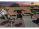 Charming single-Gathering home featuring a desert landscape, a two-car garage, and a tile roof at 9130 W Rimrock Dr, Peoria, AZ 85382