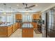 The spacious kitchen has granite countertops, stainless steel appliances, lots of storage, and a breakfast bar at 9130 W Rimrock Dr, Peoria, AZ 85382