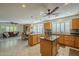 Open kitchen featuring wood cabinets, tile floors, stainless steel appliances and an island at 9130 W Rimrock Dr, Peoria, AZ 85382