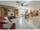 Spacious living room featuring large built-in shelving, dining area and open floor plan to kitchen at 9130 W Rimrock Dr, Peoria, AZ 85382