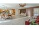 Open living room featuring tiled floors, modern furniture and access to kitchen and other living spaces at 9130 W Rimrock Dr, Peoria, AZ 85382