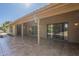 Spacious covered patio with multiple access points, offering a seamless transition to the outdoors at 9130 W Rimrock Dr, Peoria, AZ 85382