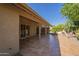 Expansive covered patio area showcasing a comfortable outdoor living space and landscaped backyard at 9130 W Rimrock Dr, Peoria, AZ 85382