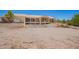 Expansive two-story home featuring a large upper deck overlooking a private outdoor area at 9736 E Sleepy Hollow Trl, Gold Canyon, AZ 85118