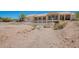 View of home's backyard and pool from a natural wash at 9736 E Sleepy Hollow Trl, Gold Canyon, AZ 85118