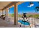 View from covered balcony with telescope overlooking pool and desert landscape beyond at 9736 E Sleepy Hollow Trl, Gold Canyon, AZ 85118