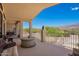 Spacious covered balcony with fire pit and lounge seating offering scenic views at 9736 E Sleepy Hollow Trl, Gold Canyon, AZ 85118
