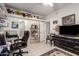 Room features neutral walls, desk with shelving, and door to bathroom at 9736 E Sleepy Hollow Trl, Gold Canyon, AZ 85118