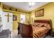 Bedroom with door to bathroom, natural light, and ceiling fan at 9736 E Sleepy Hollow Trl, Gold Canyon, AZ 85118