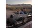 Fishing boat and trailer with beautiful mountain range backdrop at 9736 E Sleepy Hollow Trl, Gold Canyon, AZ 85118