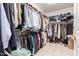 Well-organized walk-in closet with shelving and hanging space for clothes and accessories at 9736 E Sleepy Hollow Trl, Gold Canyon, AZ 85118