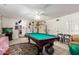 Game room featuring a pool table, tile floors, and access to the backyard at 9736 E Sleepy Hollow Trl, Gold Canyon, AZ 85118
