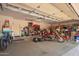 Spacious garage with motorcycles and bicycles parked inside, showing storage options at 9736 E Sleepy Hollow Trl, Gold Canyon, AZ 85118
