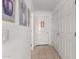Hallway with art on the walls and tile flooring at 9736 E Sleepy Hollow Trl, Gold Canyon, AZ 85118