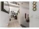 Bright hallway with tile flooring, decorative mirror, and view into the living area at 9736 E Sleepy Hollow Trl, Gold Canyon, AZ 85118