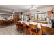 Large kitchen with island featuring a breakfast bar, lots of cabinets, and views to the outside at 9736 E Sleepy Hollow Trl, Gold Canyon, AZ 85118