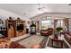 Spacious living room featuring a treadmill, high ceilings, tile floors, and a mountain view at 9736 E Sleepy Hollow Trl, Gold Canyon, AZ 85118