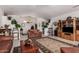 Spacious living room with high ceilings, tile floors, leather furniture, and a decorative rug at 9736 E Sleepy Hollow Trl, Gold Canyon, AZ 85118
