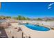 Beautiful backyard pool with rock features and desert views at 9736 E Sleepy Hollow Trl, Gold Canyon, AZ 85118