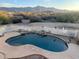 Inviting backyard pool with water feature set against a backdrop of scenic mountain views and desert landscape at 9736 E Sleepy Hollow Trl, Gold Canyon, AZ 85118