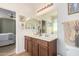 Bathroom with double vanity, spacious mirror, and great lighting at 10037 W Watkins St, Tolleson, AZ 85353