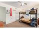 Bedroom with a bunk bed and ceiling fan provides a cozy and functional space at 10037 W Watkins St, Tolleson, AZ 85353