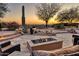 Stunning backyard featuring a fire pit and desert landscape with beautiful views, perfect for outdoor enjoyment at 10067 E Santa Catalina Dr, Scottsdale, AZ 85255