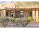 Charming home exterior with a well-maintained front garden and a welcoming entrance, blending seamlessly with nature at 10067 E Santa Catalina Dr, Scottsdale, AZ 85255