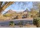 Beautiful view of a home nestled in the desert landscape, showcasing the natural beauty of the surroundings at 10067 E Santa Catalina Dr, Scottsdale, AZ 85255