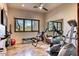 Bright home gym featuring fitness equipment, a mirrored wall, and a window with natural light at 10067 E Santa Catalina Dr, Scottsdale, AZ 85255