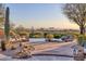 Beautiful pool area with desert views and stone accents, perfect for relaxation and enjoyment at 10067 E Santa Catalina Dr, Scottsdale, AZ 85255