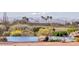 Infinity pool with mountain views, surrounded by desert plants, creating a tranquil desert oasis for relaxation at 10067 E Santa Catalina Dr, Scottsdale, AZ 85255