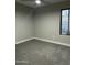 Neutral bedroom with carpet floors, ceiling fan, and a window for natural light at 1102 W Burgess Ln, Phoenix, AZ 85041