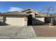 Charming single-story home featuring a two-car garage, low maintenance landscaping, and a neutral color palette at 1102 W Burgess Ln, Phoenix, AZ 85041