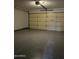 Clean garage with epoxy flooring and an automatic door, offering secure parking at 1102 W Burgess Ln, Phoenix, AZ 85041