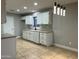 Bright and spacious kitchen with white cabinets, modern countertops, and stainless steel appliances at 1102 W Burgess Ln, Phoenix, AZ 85041