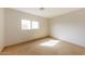 Sunny bedroom with tile flooring and a window at 11829 W Rosewood Dr, El Mirage, AZ 85335