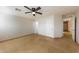 A spacious bedroom featuring tile floors and a modern ceiling fan at 11829 W Rosewood Dr, El Mirage, AZ 85335