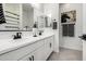 Modern bathroom features a double vanity, black hardware, decorative towels and horse art at 1211 E Jahns Dr, Casa Grande, AZ 85122