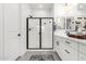 Elegant bathroom featuring sleek fixtures, a frameless shower, and a modern design at 1211 E Jahns Dr, Casa Grande, AZ 85122