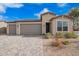 Charming single-story home featuring a three-car garage and desert landscaping for easy maintenance at 1211 E Jahns Dr, Casa Grande, AZ 85122